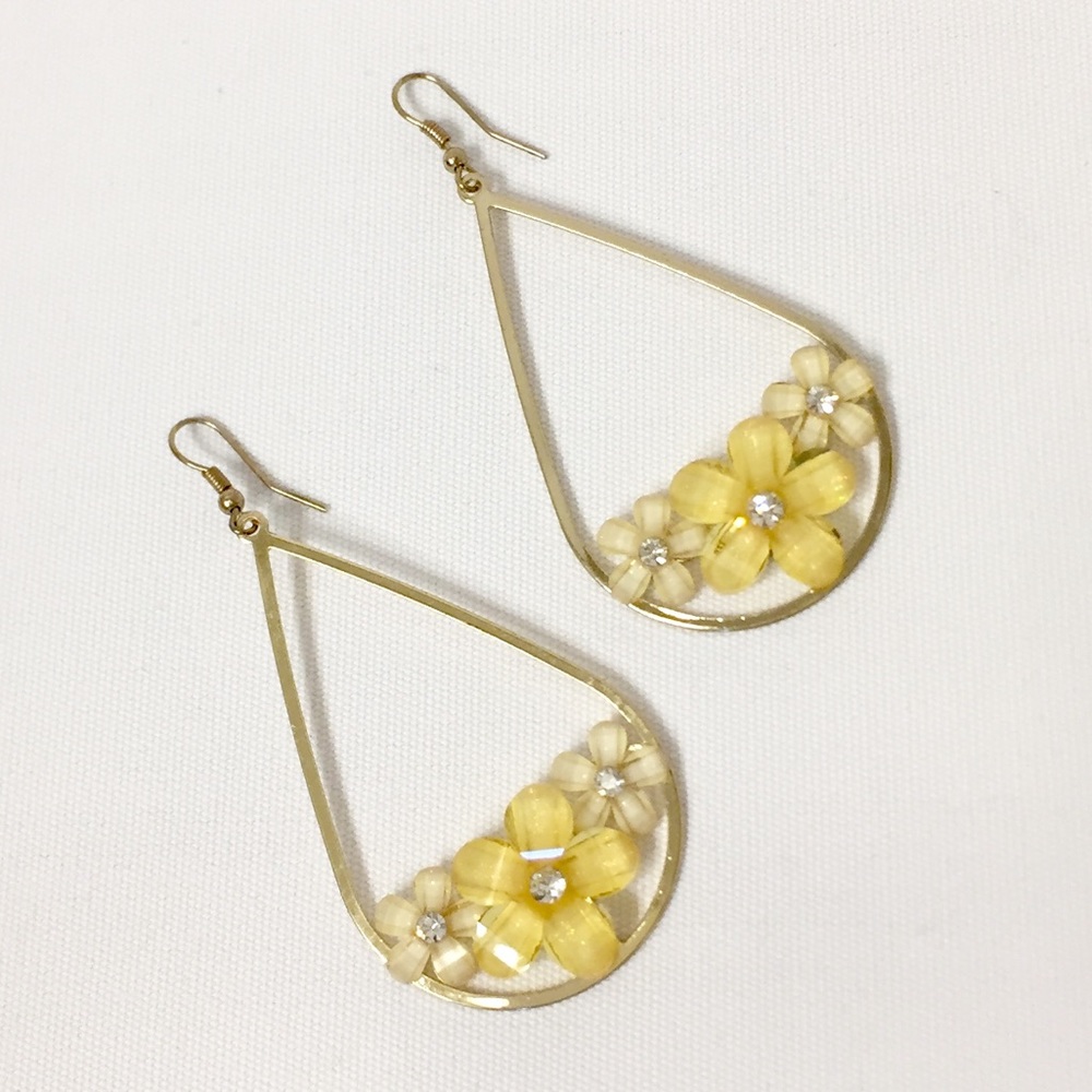 Crystal flowers on gold drop earrings. NWOT